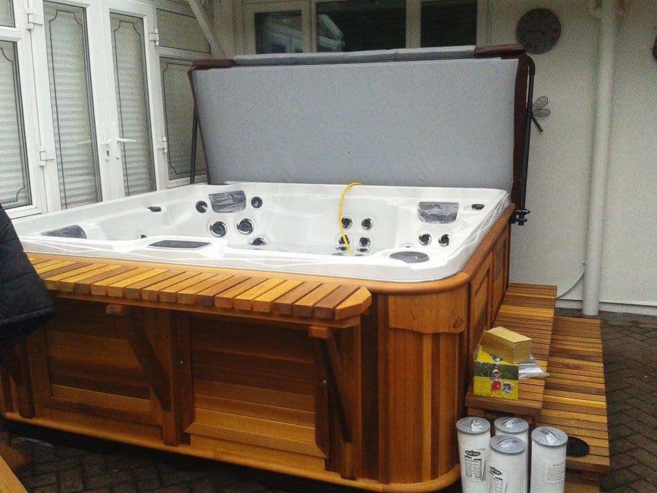 Opened Arctic Spas Hot tub in a room