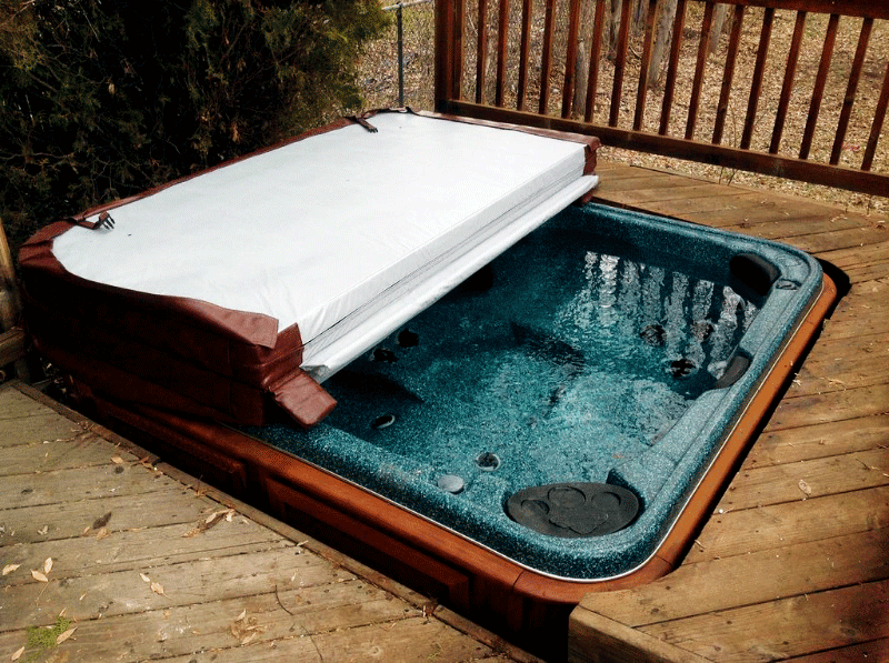 Half covered Arctic Spas Hot tub build in a deck